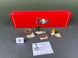 a red box that has a set of miniature figurines in it
