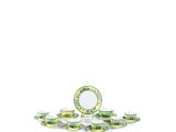 a green and white plate and cups on a white table