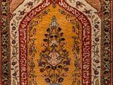 an oriental rug with a floral design on a red ground