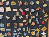 a picture of a bulletin board covered with pins and magnets
