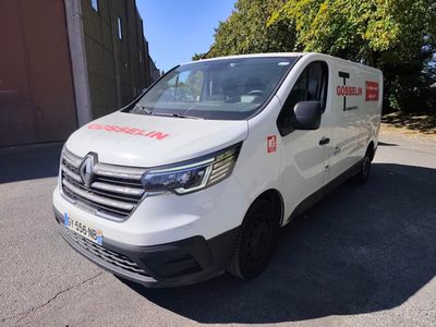 the white van is parked on the side of the road
