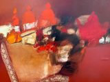 a painting of a dining room table with a lot of food on it