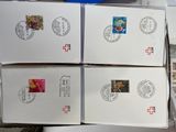 boxes of stamps are stacked on top of each other on a table