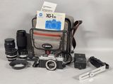 a camera and some other items on the table