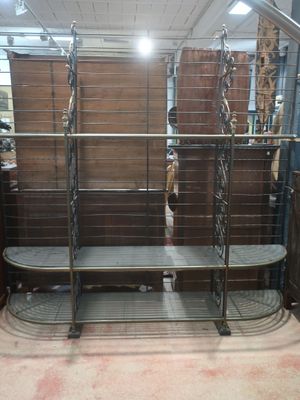 a metal shelf that has a bunch of shelves on it