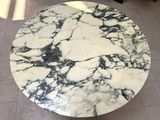 a marble table with a black and white design on it