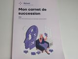 a book on a table that has a picture of a woman sitting on a puzzle piece