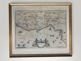an old map of the world is hanging on a wall in a room