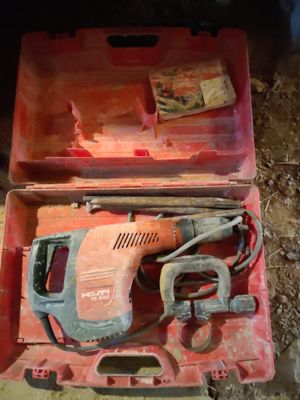 a red tool box with tools in it on the ground
