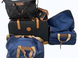 several pieces of luggage sitting on top of each other on a white surface