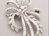 an image of a diamond bow brooch on a white background