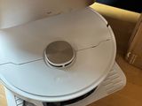 a white cd player sitting on top of a wooden table