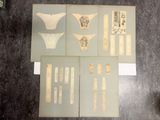 several pieces of paper with various designs on them on a table