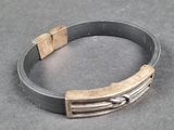 a metal bracelet with a metal buckle on it
