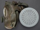 a gas mask with a filter attached to it