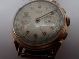 a close up of a wrist watch on a table