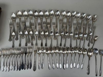 a lot of silver spoons and spoon spoons on the table