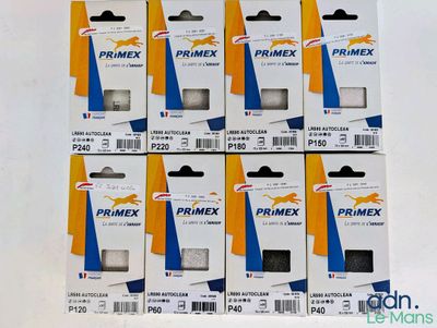 six boîtes de ruban Primex sur une surface blanche