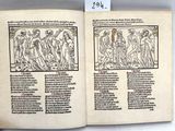 an open book with a drawing of a group of people on it