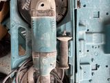 a blue box with a drill and other tools in it