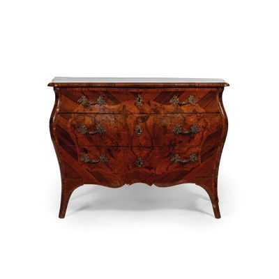 an antique chest of drawers with marble top