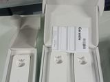 two boxes of apple products sitting on a table