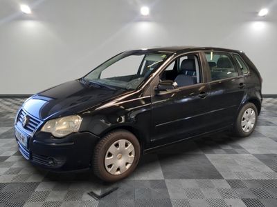 a picture of a black car parked in a garage