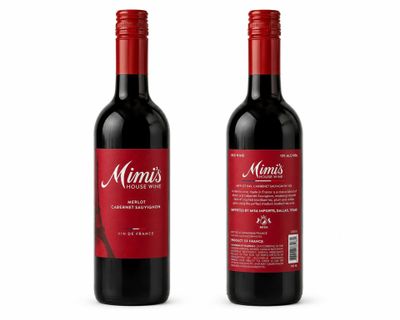 a couple of bottles of wine sitting next to each other