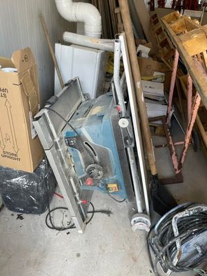 a pile of assorted items in a garage
