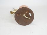 a small wooden object with a metal handle on it
