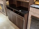 a counter with a wine glass holder on top of it
