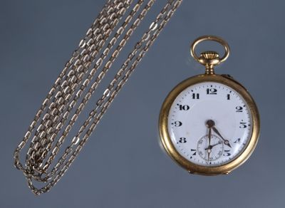 a gold pocket watch with a chain around it