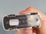 a person holding an old cell phone in their hand
