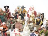 many figurines of people that are standing together