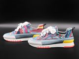 a pair of colorful sneakers on a black background