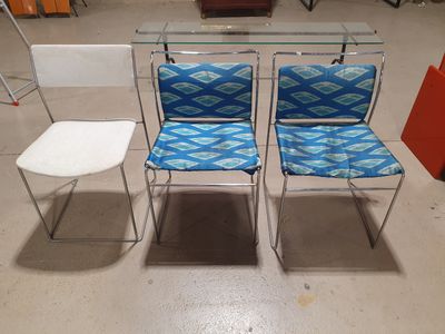 two chairs and a table in a room