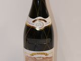 a bottle of wine that is sitting on a table