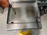 an image of a table with a metal tray on it