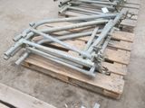 a pile of pipes on a pallet in a warehouse