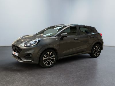 a grey ford kadgo is parked in a large room