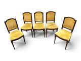 a set of six chairs with yellow upholstered seats
