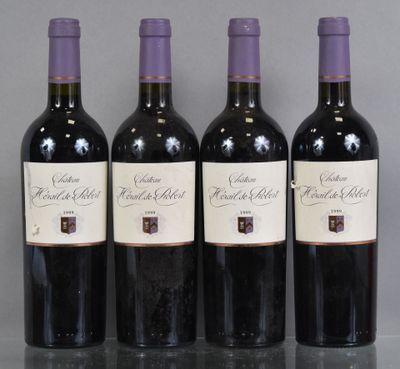 three bottles of wine are lined up on a table