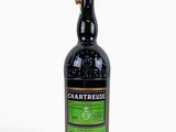 a bottle of chartreuse irish whiskey on a white background