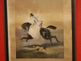 framed picture of a woman riding a horse with two birds in the foreground