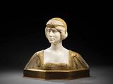 a white marble bust of a woman with a crown on her head