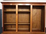 an image of a wooden bookcase with two doors and shelves