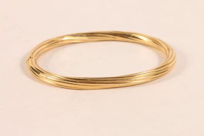 Bracelet jonc en or jaune 750 ‰ a décor torsadé. - Photo 1