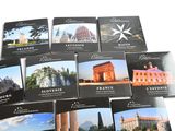 a lot of postcards that are on the table