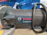 a close up of a bosch power tool on the floor