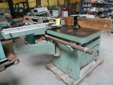a machine that is sitting in a warehouse with other machines
